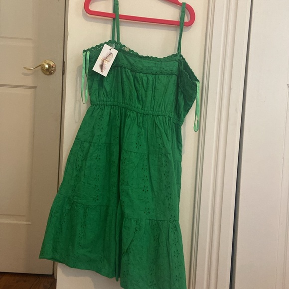 Green mini dress. New with tags and extra button. Never been worn. - Picture 2 of 3